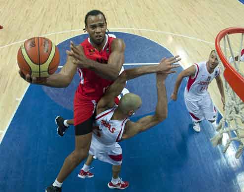 Gomes Soaquim of Angola (left) goes for a lay-up during yesterdayâ€™s FIBA-Africa World Championship match against Jordan. Angola won 79-66 points.