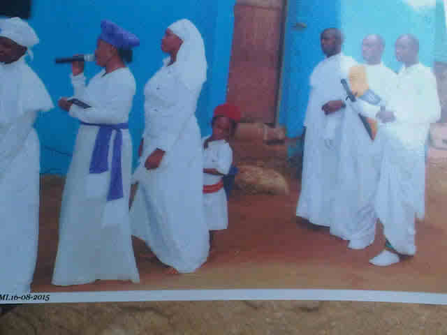 Tope inside the church with her parents and elders of the church before she was stolen