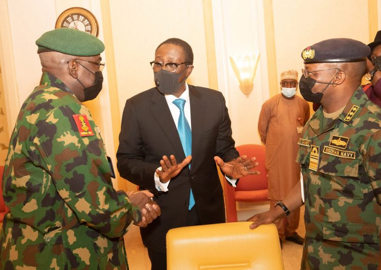 NSA Maj Gen Babagana Mongonu Confers with some service chiefs at the meeting. PHOTO; SUNDAY AGHAEZE. 